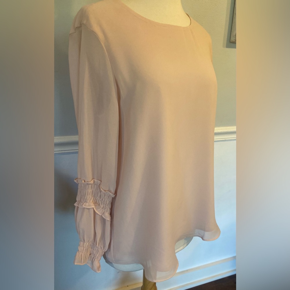 Soft pink Calvin Klein blouse. New with Tags.